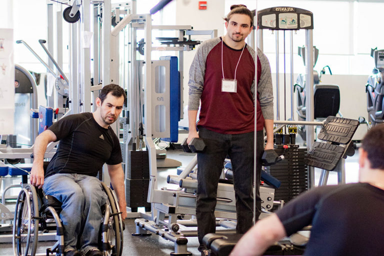 A Revved Up member exercising with a volunteer