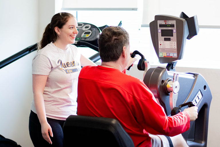 A Revved Up member exercising with a volunteer