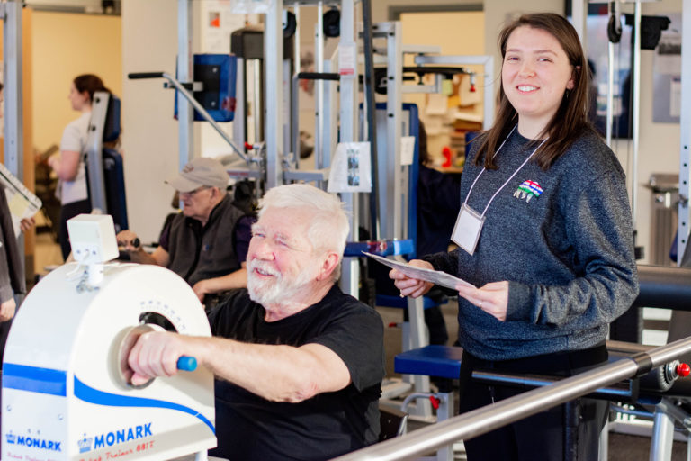 A Revved Up member exercising with a volunteer